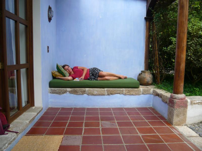 P1000695.JPG - Colleen resting outside our bedroom on our first day in Guatemala.