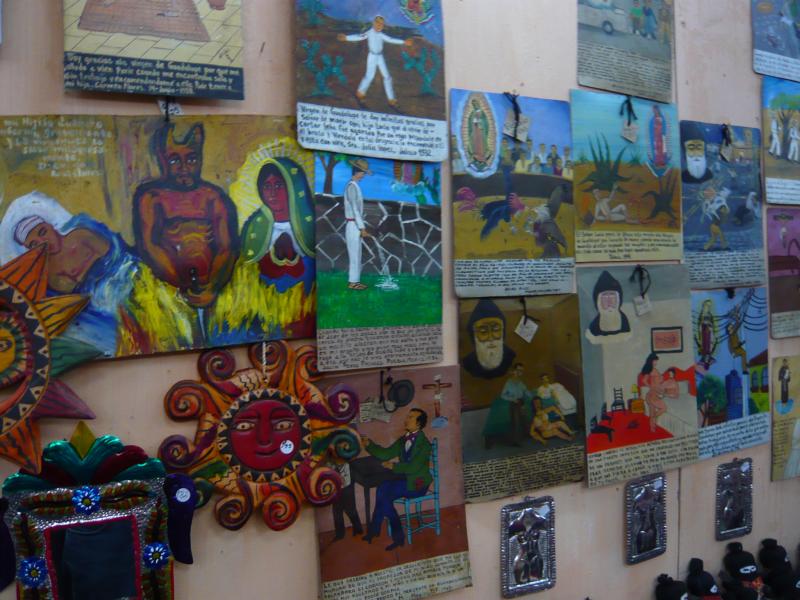 P1000745.JPG - These are paintings that we saw in a shop in Antigua. They are from Mexico and tell of religious experiences that people have had over the years. The images and text describe the bizarre events that yield these amazing stories.