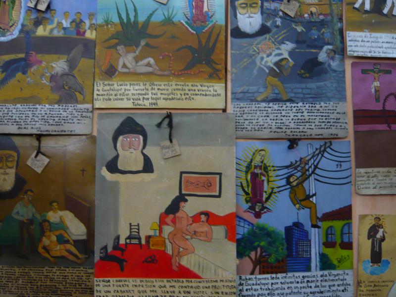 P1000747.JPG - The story on the right telss of a man who was saved from electrocution by the Virgin Mary. The one in the middle recounts how the a seduction was avoided through the intervention of a saint.