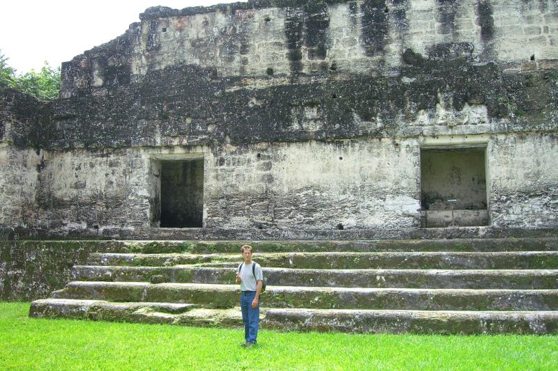 CIMG5105.JPG - Tom in front of one of the smaller buildings. These date from about 500 AD. Durting this period it is estimated that Tikal covered about 18 square miles and had a population of about 100,000 inhabitants.